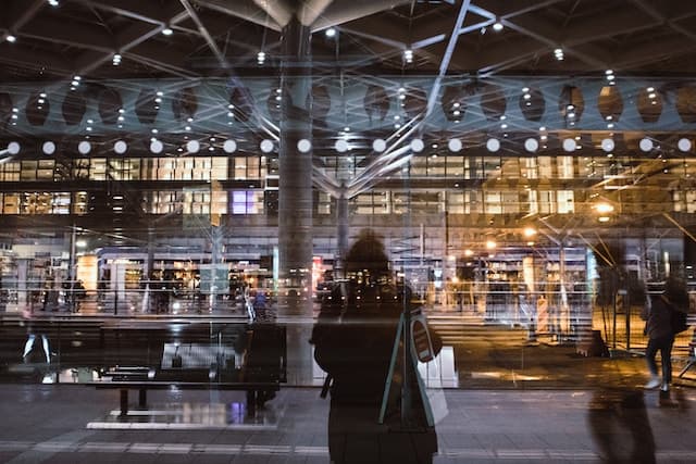 women standing outside a busy city