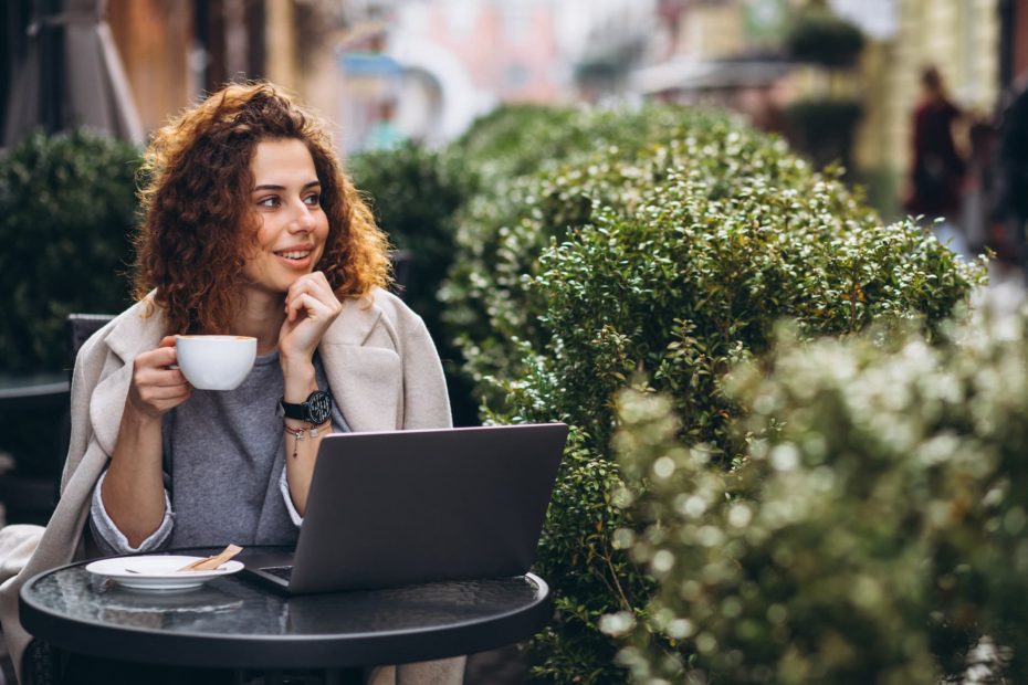 Women working outside with a coffee