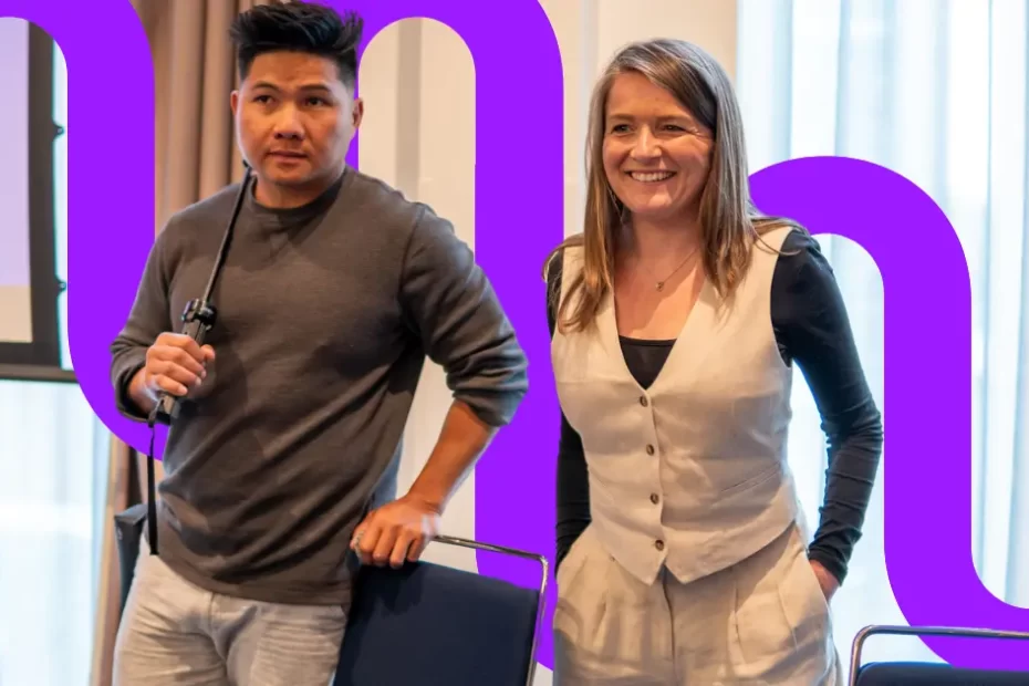 Man and woman stand together at a conference